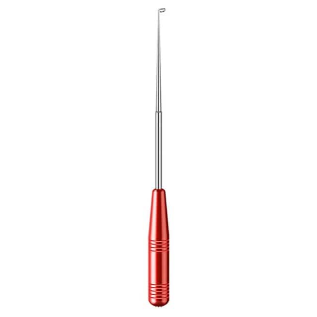 Angler safely detaching a hook from a fish using the Take Off Hooks Tool.