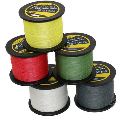 Five spools of fishing line in yellow, red, green, white, and gray on a white background.