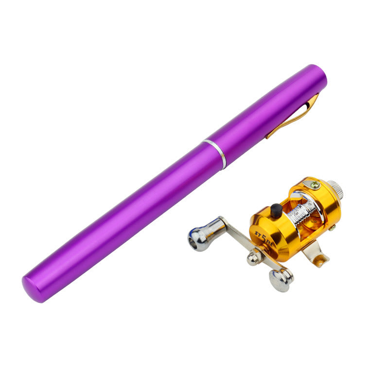 Purple pen and gold fishing reel on a white background