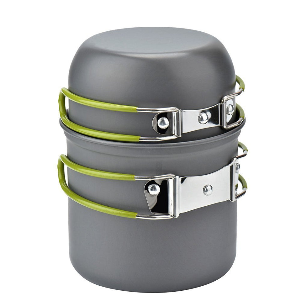 Gray camping cookware set with green handles on a white background