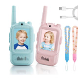 Two walkie-talkies, one blue and one pink, with screen displays of children's faces, accompanied by a USB cable and lanyards.