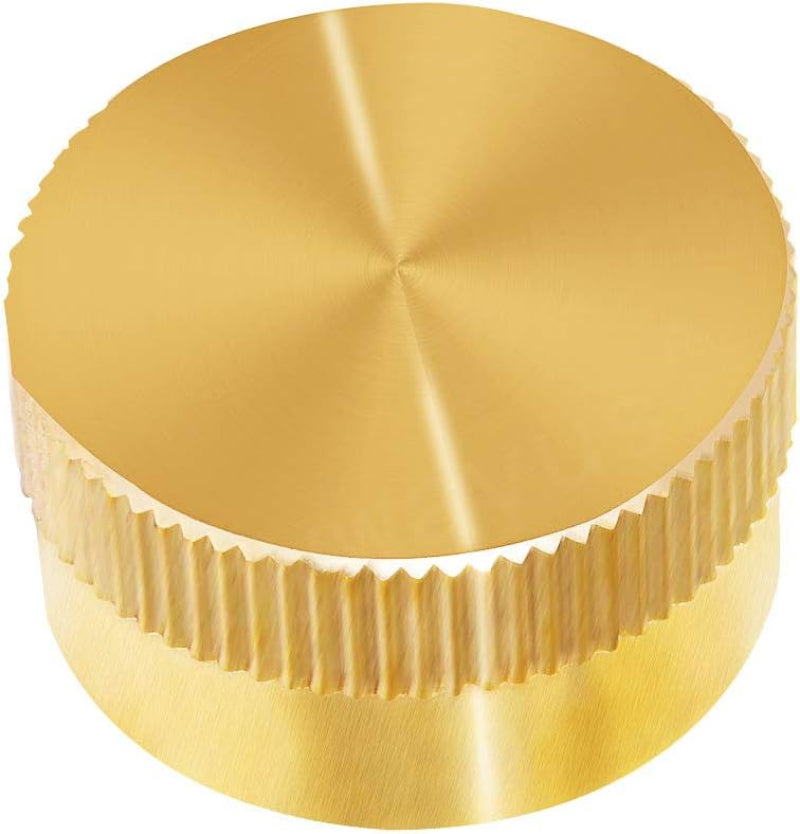 Gold metal cap with textured surface on a white background