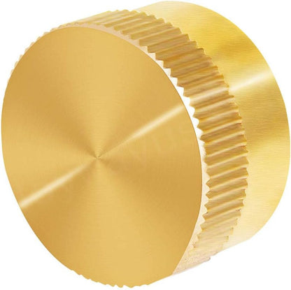 Gold metal knob with textured design on a white background