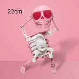 Pink skeleton figure with sunglasses on a pink background, labeled '22cm'.