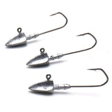 Three metal fishing jigs on a white background