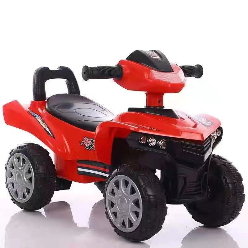 Red toy ATV with black accents on a white background