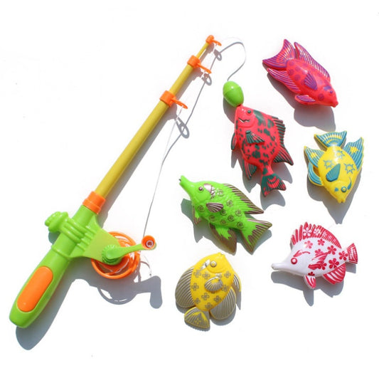 A set of colorful magnetic fishing toys, including six fish in various colors and a yellow fishing rod, against a white background.