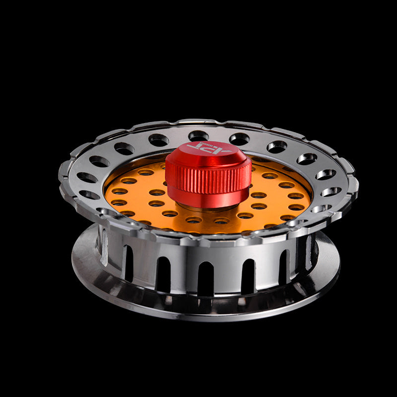 Close-up of an all-metal fishing reel with a center wheel for smooth operation.