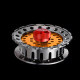 Close-up of an all-metal fishing reel with a center wheel for smooth operation.