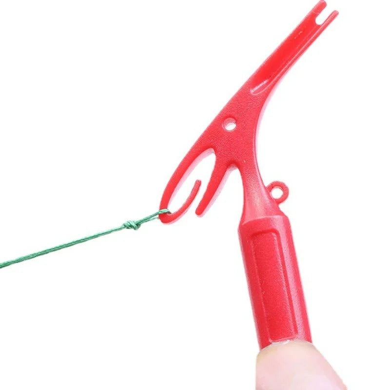 Compact pen-shaped knot tool with carabiner clip for easy portability on fishing trips