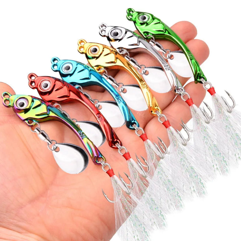 Colorful fishing lures held in a hand against a white background