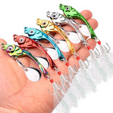 Colorful fishing lures held in a hand against a white background