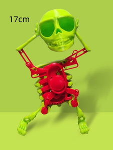 Toy skeleton with green head and red body on a green background