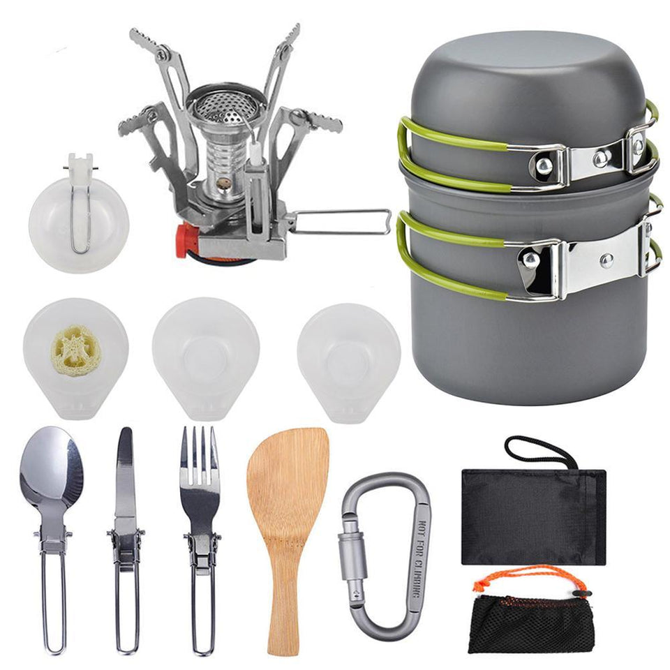 Collection of camping cookware and utensils including a stove, pots, and various tools on a white background.